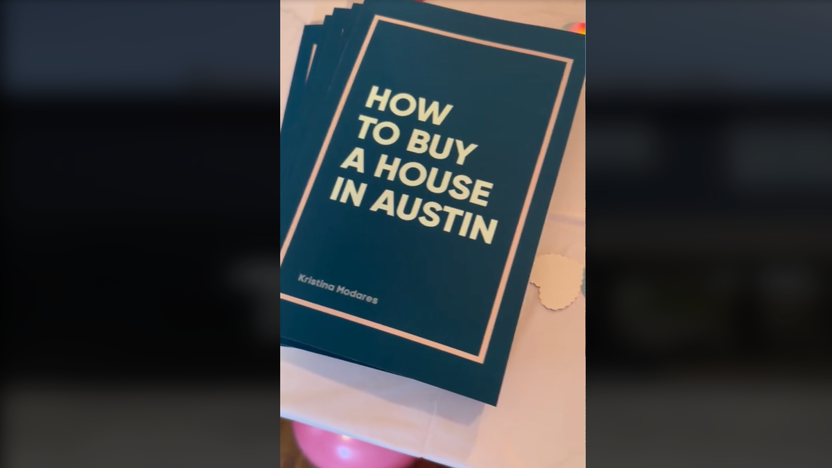 Dark green booklets titled 'How to Buy a House in Austin' on a table